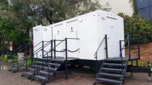 luxury porta potty trailer at an event outdoors